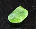 raw Olivine (Peridot, Chrysolite) crystal on black