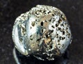 rolled Pyrite (fool\'s gold) rock on black