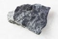 rough gray Basalt rock on white marble Royalty Free Stock Photo