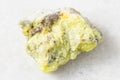 rough native Sulphur (Sulfur) rock on white marble