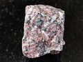 Rough pink Granite rock on black