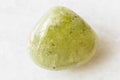 Tumbled Grossular green garnet rock on white