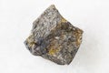 unpolished Bornite with Chalcopyrite rock on white