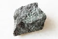 unpolished Magnetite ore on white marble