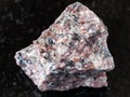 Unpolished pink Granite rock on black