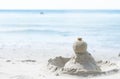 Closeup sand and stone pile on the beach with water for holiday and relax conept Royalty Free Stock Photo