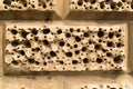 Closeup sandstone bricks wall decoration holes background Royalty Free Stock Photo