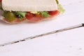 Closeup of a sandwich with cherry tomatoes lettuce and tuna in a plate Royalty Free Stock Photo