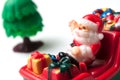 Santa claus on miniature toy train on white backgroun Royalty Free Stock Photo