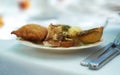 Closeup of savoury snacks served on porcelain plate and dish at a high tea event or fine dining restaurant. Texture