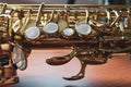 Closeup of saxophone keys on a wood surface Royalty Free Stock Photo