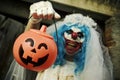 Scary evil clown in a bride dress on halloween