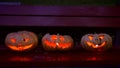 Closeup of scary halloween carved glowing pumpkins