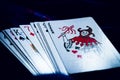 Closeup of a scattered deck of cards on a dark surface Royalty Free Stock Photo