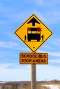 Closeup of a School Bus Stop Ahead Sign Against a Blue Sky Royalty Free Stock Photo