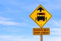 Closeup of a School Bus Stop Ahead Sign Against a Blue Sky Royalty Free Stock Photo