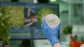 Closeup of scientist woman holding in hands petri dish with vegan beef meat Royalty Free Stock Photo