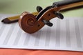 Closeup Scroll of violin put on blank note shee Royalty Free Stock Photo