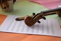 Closeup Scroll of violin put on blank note shee Royalty Free Stock Photo