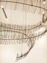 A closeup of a sculpture of sticks and wires hanging from the ceiling Royalty Free Stock Photo