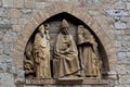 Closeup of sculpture of three religious figures Cathedral, Volterra, Tuscany, Italy