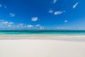 Closeup of sand on beach and blue summer sky. Panoramic beach landscape. Empty tropical beach and seascape. Orange and golden suns Royalty Free Stock Photo