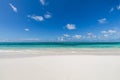 Closeup of sand on beach and blue summer sky. Panoramic beach landscape. Empty tropical beach and seascape. Orange and golden suns Royalty Free Stock Photo