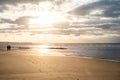 Closeup sea sand beach with silhouette of couple walking . Panoramic beach landscape. Inspire tropical beach seascape