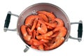 Shrimps in a red colander on a white background top view Royalty Free Stock Photo