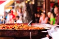 Closeup of Seafood Paella in a large frying pan at Chatuchak weekend market in Bangkok - Thailand