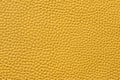 Closeup of seamless yellow leather texture