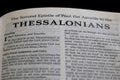 Closeup of the second Book of Thessalonians from Bible, with focus on the Title of religious text.