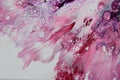 Closeup of a flowing abstract acrylic pour painting in shades of pink and white. Royalty Free Stock Photo