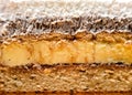 Closeup section through a slice of cream cake