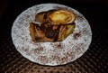 Closeup of sections of tiramisu pancakes with cocoa sprinkles