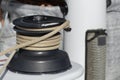 Closeup of secured rope on winch on board sailing boat racer