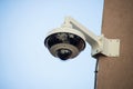 security camera on stoned wal in the street Royalty Free Stock Photo
