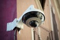 Security camera on stoned wal in the street Royalty Free Stock Photo