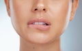 Closeup of seductive and sensual lip bite on unknown woman in studio. Caucasian model with sexy plump lips isolated Royalty Free Stock Photo