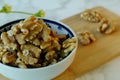 Closeup and selective focus of shelled walnuts pile in a bowl