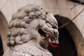 Closeup selective focus shot of a marble Asian creature statue