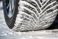 Closeup selective focus on snow packed in an all-weather tire tread. Royalty Free Stock Photo