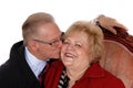 Closeup of senior kissing his wife.