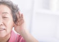Closeup senior woman hearing loss , Hard of hearing