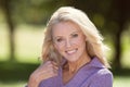 Closeup Of A Senior Woman Smiling At the Camera At The Park Royalty Free Stock Photo