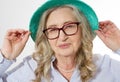 Closeup of senior woman wrinkle face. Old lady in stylish glasses and hat. Skin care and makeup concept Royalty Free Stock Photo