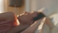 Closeup serene woman waking up in morning sunlight. Sleepy girl posing in bed Royalty Free Stock Photo