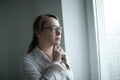 Close up.serious business woman looking out the window of the office Royalty Free Stock Photo