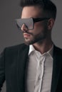 Closeup of serious fashion model looking away, wearing sunglasses Royalty Free Stock Photo