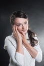 Closeup. serious young woman in white sweater.isolated on black